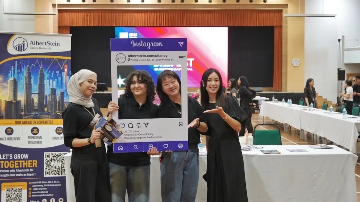 AlbertStein team participating in a SEGi College booth showcase, engaging with students and visitors.